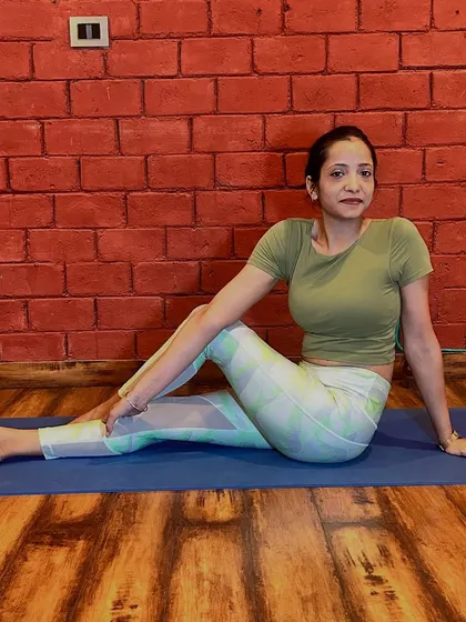 A gentle seated spinal twist, or Ardha Matsyendrasana, can help improve digestion and increase spinal flexibility. During pregnancy, we modify this pose to ensure it is safe and comfortable, creating space for the belly while still getting the benefits of the twist.