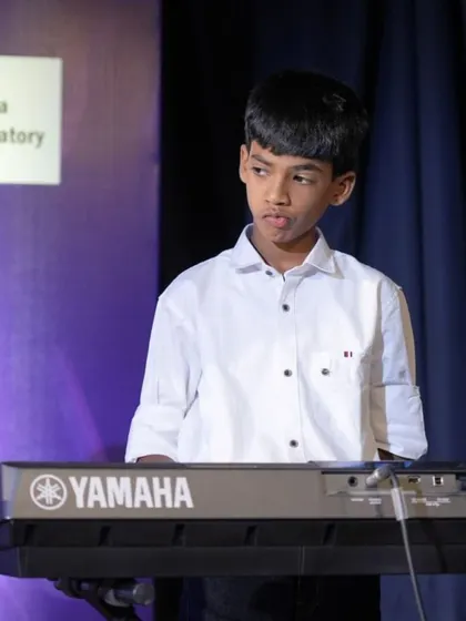 A collection of photos from our keyboard ensemble's performance of 'Chand Sifarish'. These shots capture the focus and joy of our young musicians and their teachers on stage.