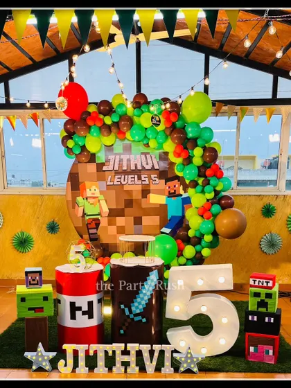 Jithvi leveled up to 5 with this awesome Minecraft-themed party. I used pixelated backdrops, character cutouts of Steve and Alex, and props like TNT blocks and creepers to bring the popular game to life.