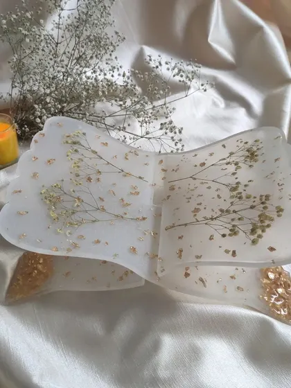 A view of the holy book stand on its own. The combination of milky white resin, delicate flowers, and gold flakes creates a serene and elegant look.