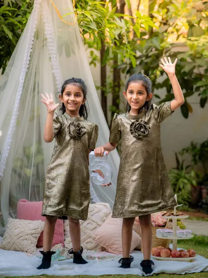 A fun, outdoor birthday picnic for these five year old twin sisters. We set up a stylish teepee and props to create a playful and celebratory atmosphere for their milestone photoshoot.