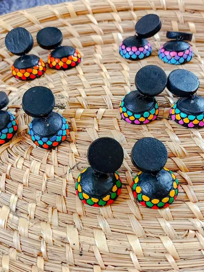 These images display the extensive variety of earrings I create, from jhumkas to studs and danglers, all showcasing different patterns, colors, and shapes ready for bulk orders.