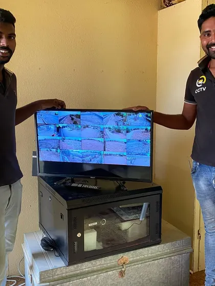 My team and I with a completed system setup. The monitor is displaying the live feed from all the newly installed cameras.