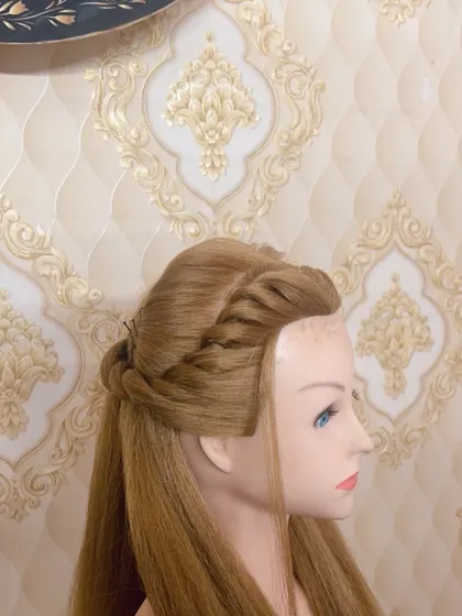 A still image of the waterfall twist hairstyle, showing the clean sections and smooth finish.