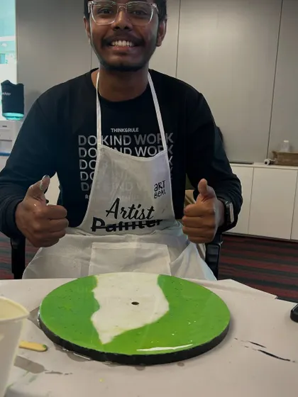 Thumbs up from another happy participant at the NetApp resin clock workshop. These events are all about positive experiences and building stronger team connections.
