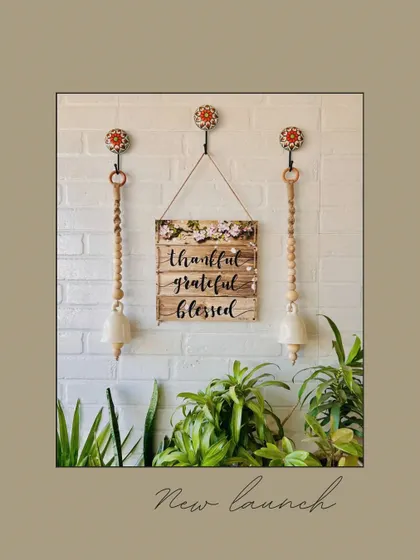 A new launch featuring our serene jute ivory bells. This wall decor set combines the bells with a 'Thankful, Grateful, Blessed' wooden hanging, all suspended from hand-painted ceramic hooks for an earthy, boho look.