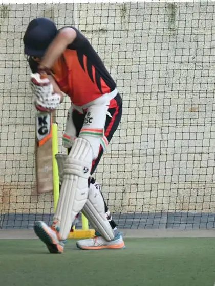 A player practices his front-foot defense in the nets. A solid defense is the foundation of a great innings, and we dedicate ample time to perfecting it.