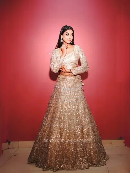 A final full-length view of the golden lehenga, perfect for making a statement.