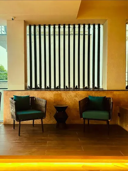 A wider view of the balcony seating, showing how under-platform lighting adds a warm and inviting glow to the space in the evening.