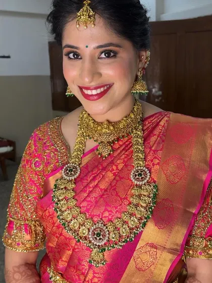 A close-up portrait showcasing the flawless finish of this Muhurtham makeup. The skin looks luminous and healthy, which is the foundation of my bridal style.