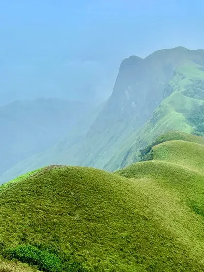 The Western Ghats are not just about waterfalls. Look at these rolling green hills on the Netravathi Peak trek. The feeling of walking above the clouds, with endless shola grasslands around you, is a different kind of magic.