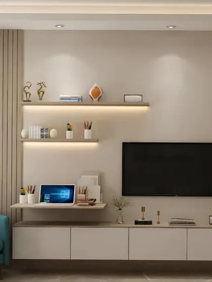 This floating TV unit integrates a small work desk, making it a multi-functional piece for a modern living room. The combination of white cabinetry, wood-look panels, and backlit shelves creates a light and airy feel.