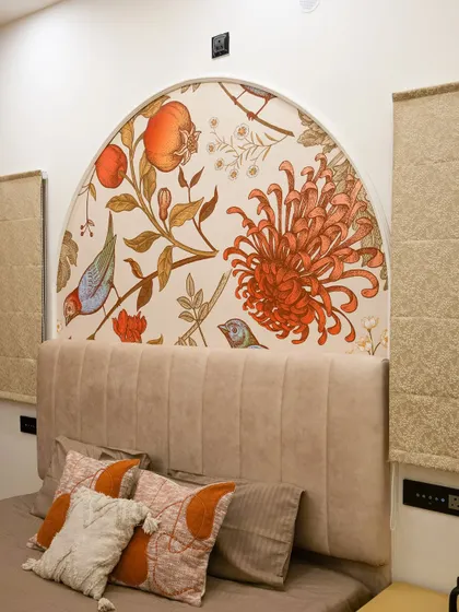 Details are the whispers in a home's story. This custom hand-painted mural, designed as an arched headboard, brings a unique artistic touch and a splash of colour, turning a simple wall into a personal masterpiece.