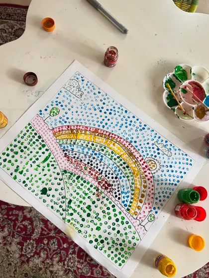 A beautiful rainbow landscape created using Pointillism. We learned about Georges Seurat and how he used tiny dots of color to build an image. It’s all about patience!