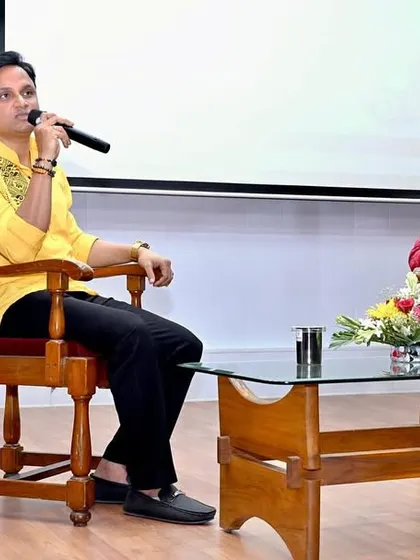 Engaged in a Q&A session during a corporate workshop. I believe in creating an interactive environment where people can get practical answers to their health questions.