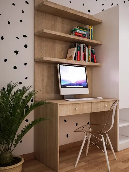 A simple and modern study area with a wooden desk and open shelves, set against a fun, dalmatian-print accent wall.