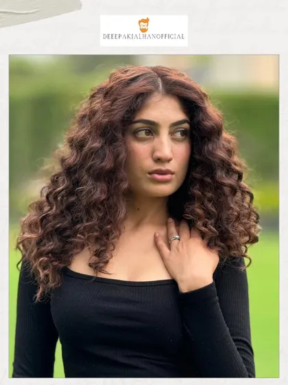 A close-up on these bouncy, beautiful curls. The textured cut enhances the natural pattern, creating a look that is both bold and easy to manage.