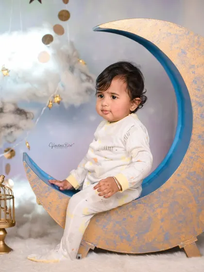 A cozy pajama-themed shoot on our moon set. The soft lighting and cloud props make it the perfect backdrop for capturing sleepy, angelic moments.