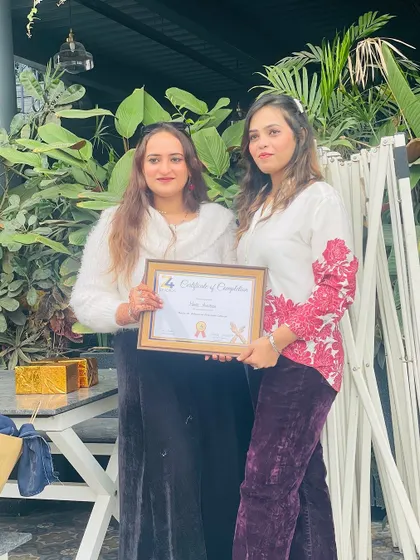 A proud moment with another graduate from the Z4 Studios henna course.