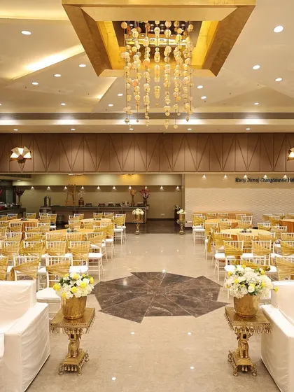Another view of the spacious banquet hall, ready for the Mehendi celebration. I handle all venue layout and seating arrangements to maximize comfort and flow.