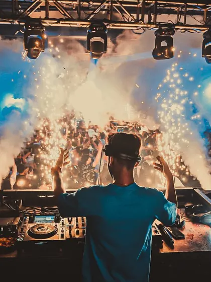 My view from the DJ booth at Waters, Pune, as cold pyro sparks light up the crowd. I use a variety of effects to create a dynamic and visually stunning show.