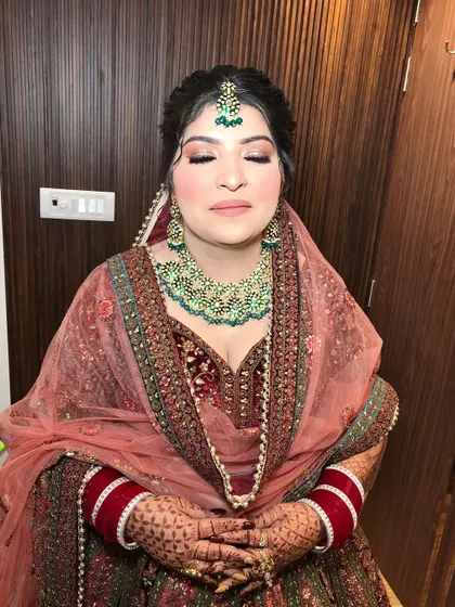A serene moment captured, showing the bride ready and waiting.