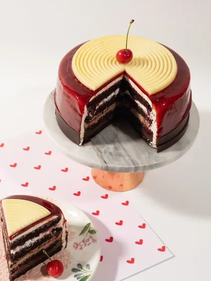It's all about that perfect slice. This cake features a glossy mirror glaze and rich, decadent layers inside. I believe a cake must taste even better than it looks, and this one definitely delivers.