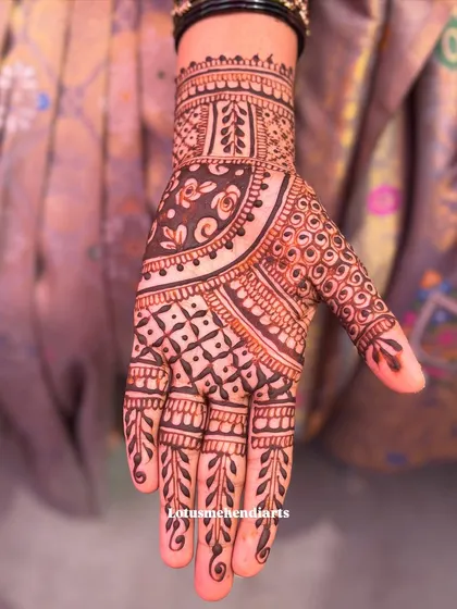 A gorgeous design for a guest, featuring a mix of traditional Indian patterns like grids, paisleys, and florals.