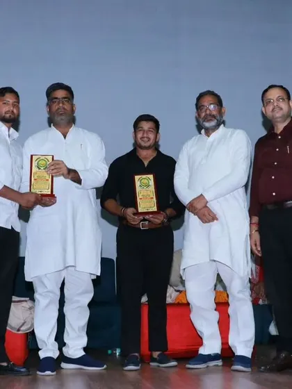 On stage receiving an award for our contribution to sports. Recognition like this fuels our drive to work even harder.
