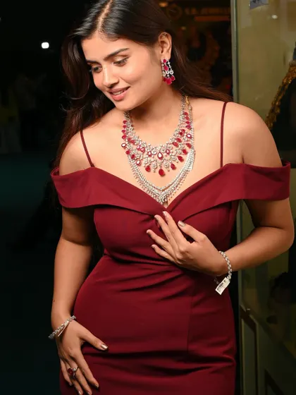 A modern and elegant look for a diamond and ruby necklace. This shows the brand's versatility, appealing to a contemporary audience for evening wear.