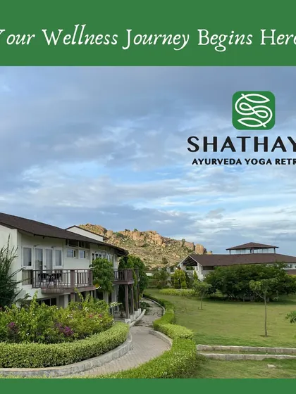 A welcoming view of our accommodation buildings set against the backdrop of the rocky hills. This image, with our logo, serves as an invitation to begin your wellness journey with us.