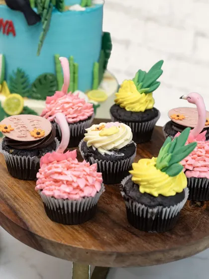 The tropical dessert spread also included these delicious chocolate cupcakes, topped with pineapple-leaf and pink flamingo-inspired frosting to match the main cake.