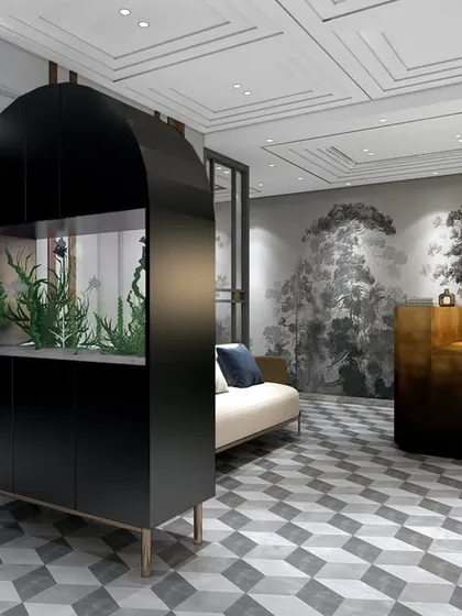A unique feature in the lawyer's office is this arched black cabinet housing an aquarium. It acts as a beautiful and calming space divider, adding a touch of life and sophistication.