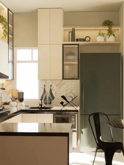 This kitchen design plays with fifty shades of taupe. The calm, earthy tones create a soothing atmosphere. We incorporated open shelving with integrated lighting to display plants and decor, adding life and personality to the functional space.