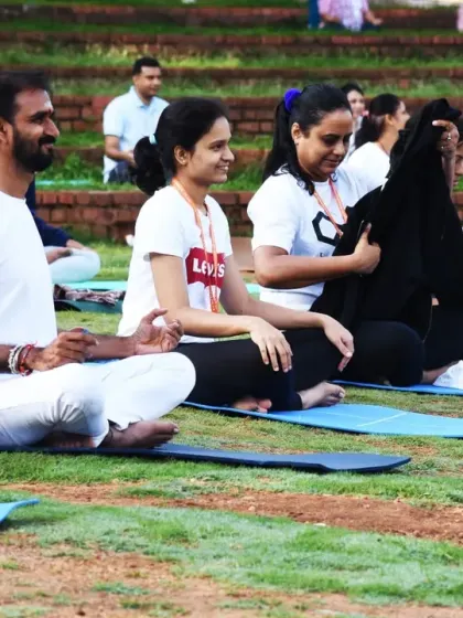 Participants enjoying a moment of rest and connection during a yoga session. Our programs offer many opportunities for Seva (volunteering), which is a beautiful way to experience transformation through service and community.