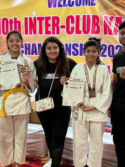 Our young female competitors with their medals and certificates. We are proud to have a strong representation of girls in our karate program.