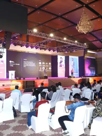 We excel at capturing the full scale of your event. This wide-angle shot of the UXINDIA 2024 summit shows the large, engaged audience and the professional stage production, demonstrating our capacity for covering major conferences.