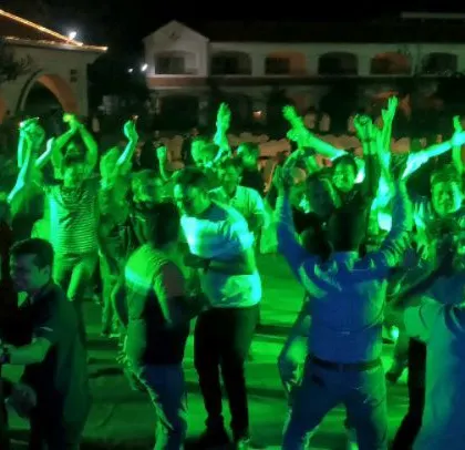 Another shot of the energetic corporate crowd. Their enthusiasm fuels my performance and makes for an incredible night.