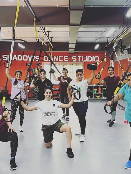 Our community loves TRX classes. This group photo captures the energy and camaraderie after a challenging suspension training session that works every muscle in the body.