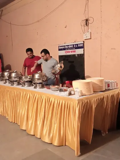 Setting up the chafing dishes for an event. We ensure everything is in place before the food service begins.