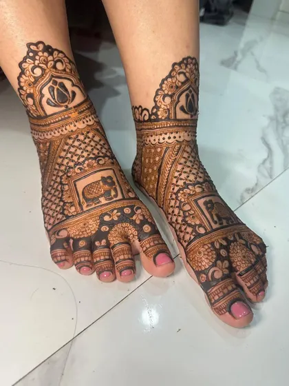 A side view of the bridal feet, showing the beautiful cuff and intricate details.
