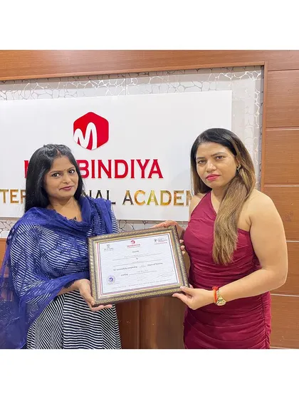 Celebrating the hard work and success of another student on her certification day.