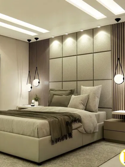 A close-up of the bed with the upholstered and fluted headboard.