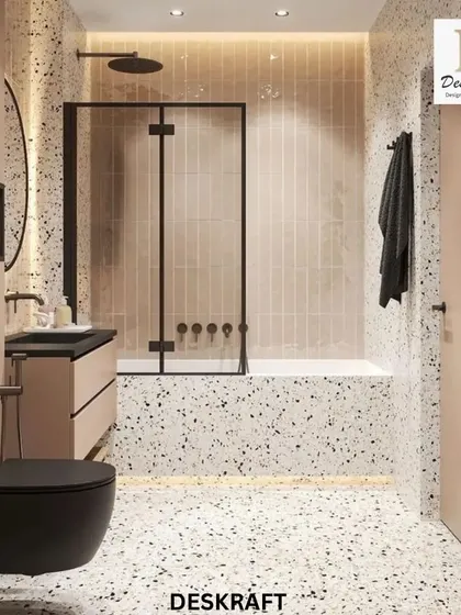 A full view of the bathroom layout, showing the bathtub and shower combination enclosed by a black-framed glass screen, which complements the other black fixtures.