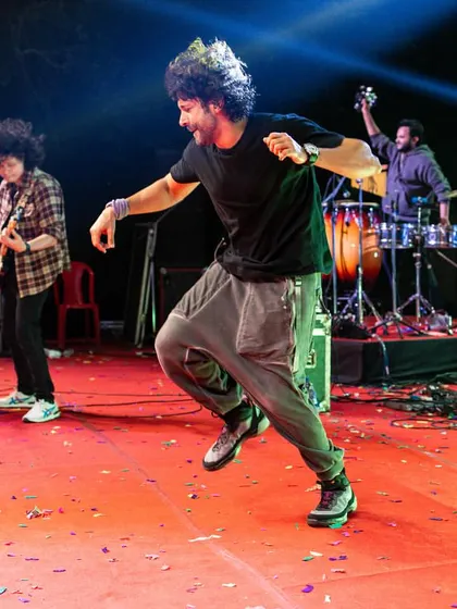 Dancing to the beat on stage with the band. A performance is not just about playing; it's about feeling the music and sharing that infectious energy with everyone.