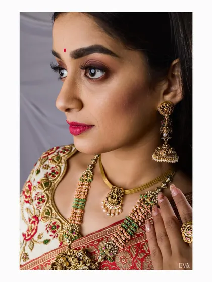 Another angle of the detailed beauty shot, providing a comprehensive look at the traditional jewellery set against the embroidered blouse.