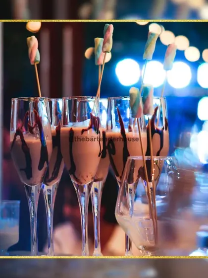 Indulgence in a glass. Our chocolate cocktails are served in elegant champagne flutes, drizzled with syrup and topped with colorful marshmallows for a truly decadent treat.