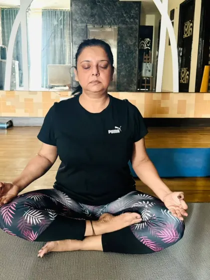 A student in a deep state of meditation during a home visit. Our personalized sessions create a peaceful and focused environment for you to connect with your inner self.