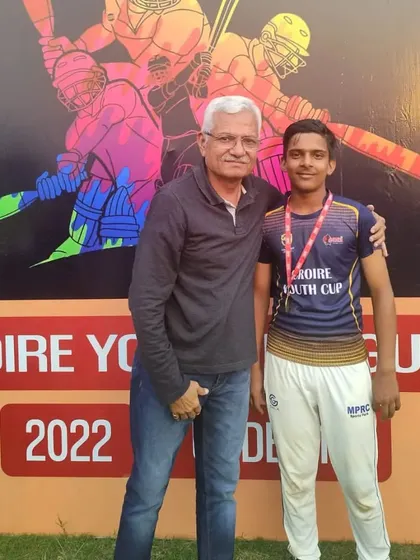 Anand Kumar Namdev, the Best Bowler of the match, with his award.