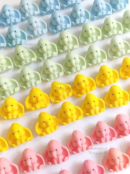 A rainbow of baby elephant candles created for a large baby shower gift box order. Each color can be matched with a different scent.